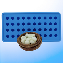 Load image into Gallery viewer, Image of blue ice tray along with a brown dish holding a bundle of frozen suppository drops for insertion into the gut exit opening of a person’s digestive tract