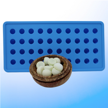 Load image into Gallery viewer, Image of blue ice tray along with a brown dish holding a bundle of frozen suppository drops for insertion into the gut exit opening of a person’s digestive tract

